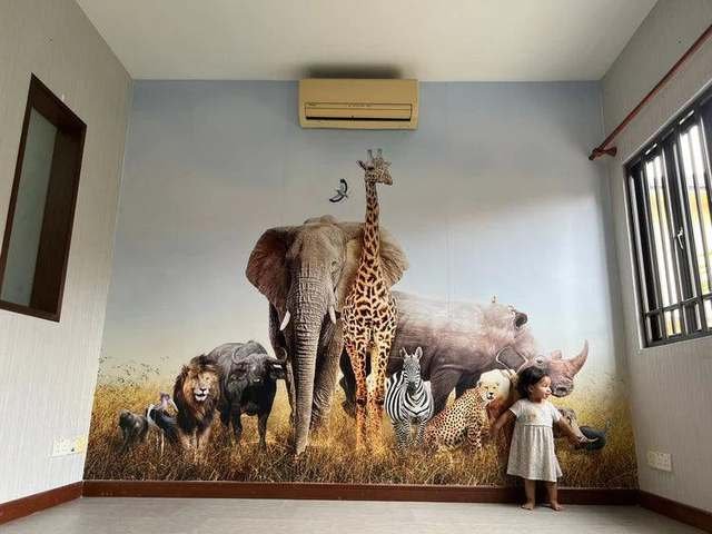 Safari animal mural in a family room